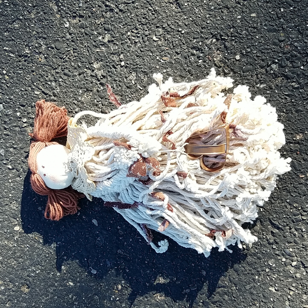 Mop doll decoration with cookie cutter.
